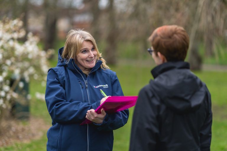 healthwatch staff talking to a member of the public